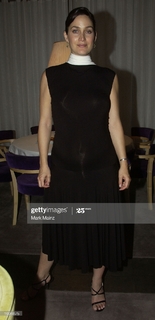 Carrie-Anne Moss feet photo thumbnail