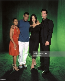 Carrie-Anne Moss feet photo thumbnail