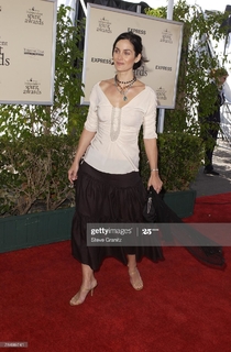 Carrie-Anne Moss feet photo thumbnail