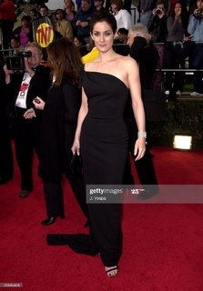 Carrie-Anne Moss feet photo thumbnail