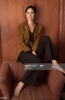 Carrie-Anne Moss feet photo thumbnail