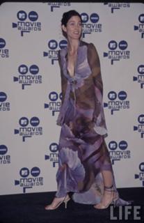 Carrie-Anne Moss feet photo thumbnail